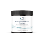 Jar of magnesium glycinate powder on a white background